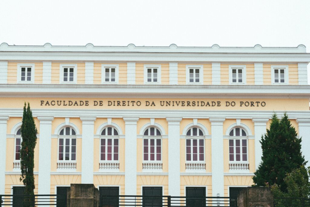 Facade of the Faculty of Law at the University of Porto, showcasing classic architecture.